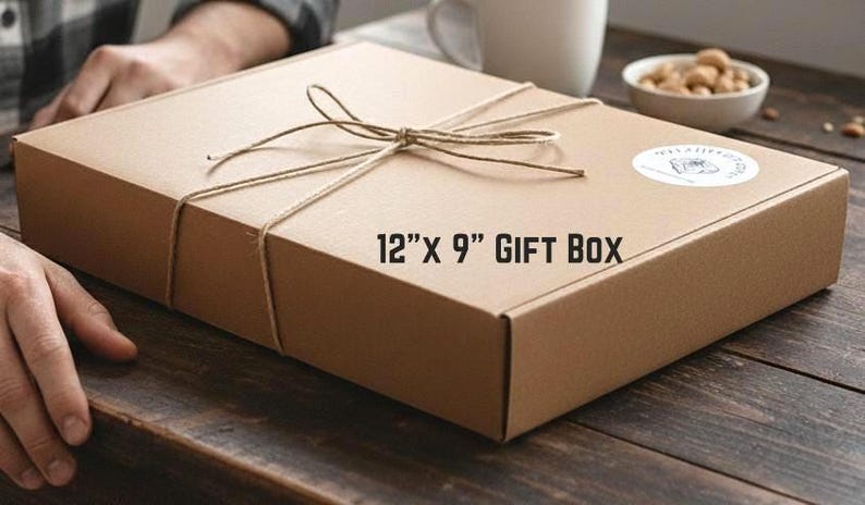 A rectangular brown gift box, 12 inches by 9 inches, tied with twine.