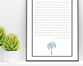 May include: A black and white inspirational quote by Theodore Roosevelt about the importance of action and perseverance. The quote is printed on a white background with a colorful flower illustration at the bottom.