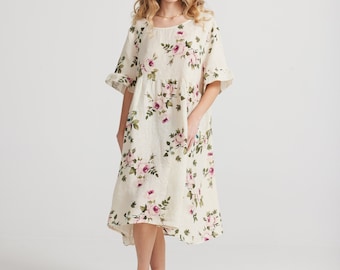 Audrey babydoll linen dress in exclusive rose printed linen in cream . Pretty floral linen dress for all occasions