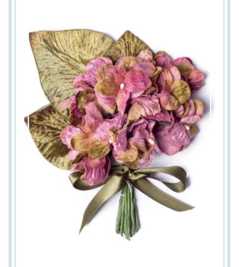 May include: A bouquet of pink velvet flowers with green velvet leaves tied with a green ribbon.