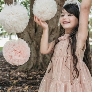 tulle pom poms,medium. pom pom decorations . hanging tulle pom poms. nursery decor. wedding decor.