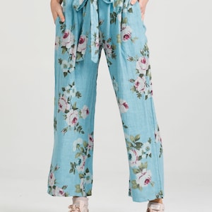 Linen trousers. Linen pants . Linen Eva floral pants by Miss Rose Sister Violet . Linen pants in floral Tahitian blue