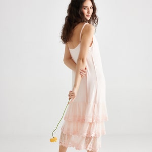 Evangeline lace ruffled slip dress in pale pink . Gorgeous lace ruffled dress that can be worn as a slip or on its own as a dress