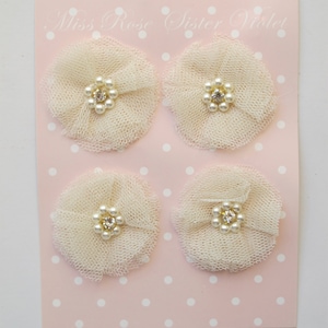 tulle and pearl adornments. tulle and pearl embellishments. tulle and pearl flowers. tulle flowers for party and wedding decor.