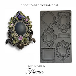 May include: An ornate, antique-style frame with a dark oval center, surrounded by sculpted leaves and flowers in shades of green, purple, and pink. Next to it is a gray silicone mold with various frame designs. The text "DECOUPAGECENTRAL.COM" and "IOD MOULD Frames" are visible.