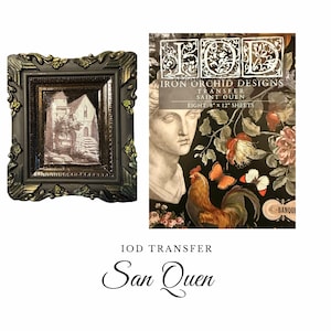 May include: An ornate, dark framed picture with a sepia-toned image of a building. Next to it is a package of Iron Orchid Designs transfer sheets, featuring a rooster, butterflies, and floral elements. The text "IOD Transfer San Quen" is also visible.