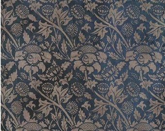 May include: A repeating pattern of stylized flowers and foliage in shades of gray and tan against a dark blue background. The words "Art Collection" are in gold script at the top. The design is reminiscent of vintage wallpaper.