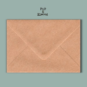 May include: A rectangular brown kraft paper envelope with a triangular flap. The text PiP & Elwood is printed in black typewriter-style font above the envelope. The envelope has a textured surface and a classic folded design for mailing.