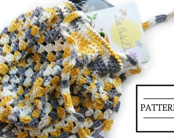 May include: A crocheted tote bag in yellow, white, and gray with a book titled "Little Owls Day" inside. The bag has a crocheted strap.