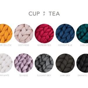 May include: Ten color swatches of chunky knit yarn in various colors, including mustard yellow, misty rose, raspberry red, midnight blue, dark green, cream white, tea rose, elegant grey, dark grey, and dramatic black. The text "CUP TEA" is at the top of the image.