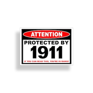 May include: A black and white sign with red text that reads "Attention Protected By 1911 If You Can Read This, You're In Range".