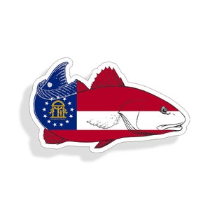 May include: A red fish with a white stripe and the Georgia state flag on its side. The fish is outlined in black and has a white shadow.