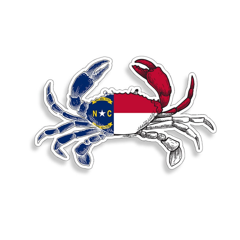 May include: A blue crab with a red claw, with the North Carolina state flag on its back. The flag is red, white, and blue with a star in the center and the letters "N*C" on it.