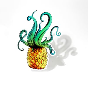 May include: A yellow pineapple with a green and blue octopus tentacle design on top.