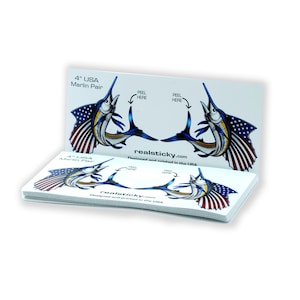 May include: A pack of 4 inch USA Marlin Pair decals. The decals feature a blue marlin with an American flag design. The decals are designed and printed in the USA. realsticky.com