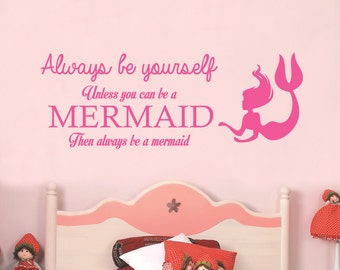 May include: Pink wall decal with the text "Always be yourself Unless you can be a MERMAID Then always be a mermaid" and a pink silhouette of a mermaid.