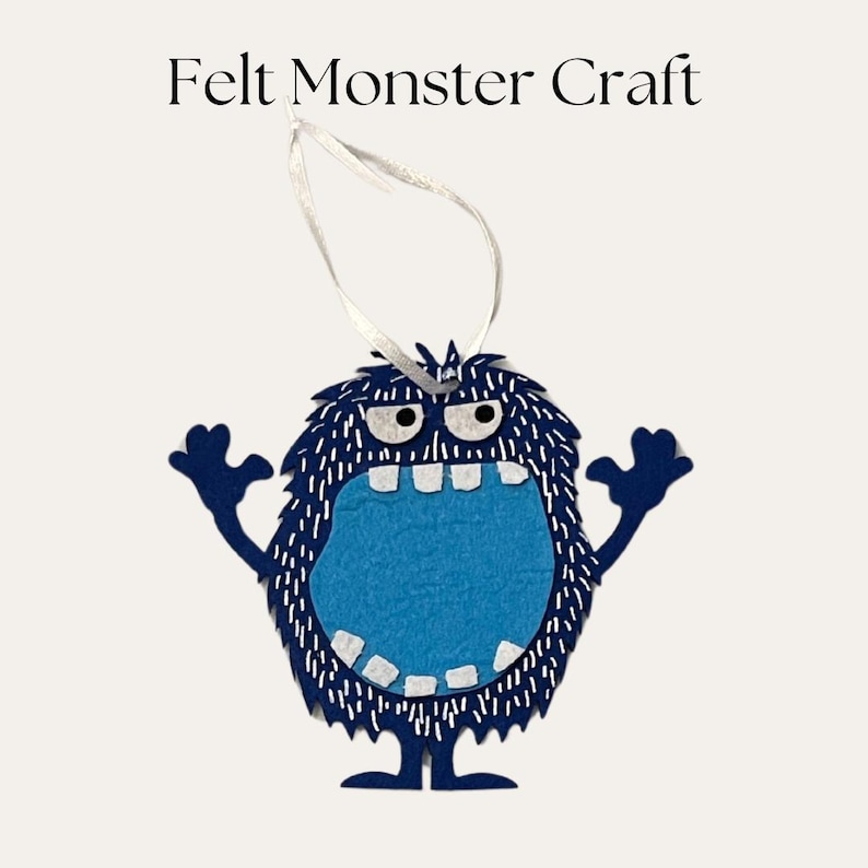 May include: A dark blue felt monster craft ornament with a light blue belly, white teeth, and two eyes. The monster has raised arms and a white ribbon loop for hanging. The text Felt Monster Craft is printed in black above the monster figure.