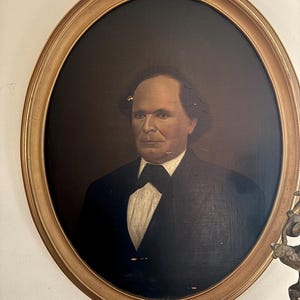 This painting is an 1800 oval O.B. Painting of a man in a gold-colored frame.