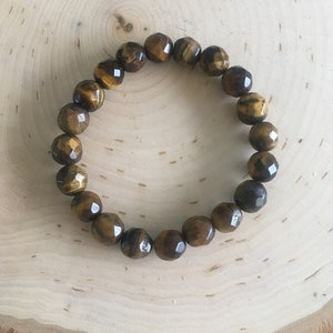 HBGEM10TGREYEBRCLET-  FACETED ROUND 10 mm Tiger Eye -  BRACELET. Sold individually.