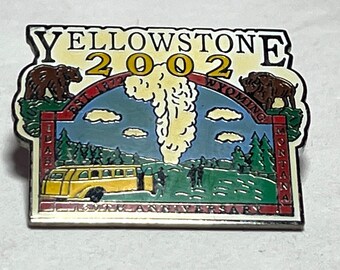 May include: A rectangular Yellowstone National Park pin with a colorful design. The pin features a yellow bus, a geyser, and two bears. The text "YELLOWSTONE 2002" is at the top, with "WYOMING" and "MONTANA" on the sides.