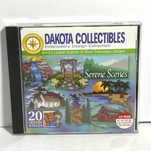 May include: A CD-ROM case featuring the "Dakota Collectibles Embroidery Design Collection." The cover displays the text "Serene Scenes" and includes various embroidery designs of landscapes, a waterfall, and a bear. The case also includes the text "20 Designs."