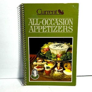 May include: A spiral-bound cookbook titled "All-Occasion Appetizers" with a green cover. The cover features the word "Current" and a picture of various appetizers, including deviled eggs and a dip with vegetables.