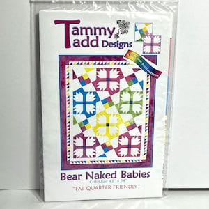 May include: A quilting pattern for a crib quilt called "Bear Naked Babies" by Tammy add Designs. The pattern is for a 43 inch by 54 inch quilt and is "Fat Quarter Friendly". The pattern features a colourful quilt design with a bear paw print motif.