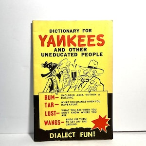 May include: A vintage paperback book titled "Dictionary for Yankees and Other Uneducated People." The cover is yellow with red and black text and illustrations of cartoon figures. The book includes definitions for words like "Rum," "Tar," "Lust," and "Wangs."