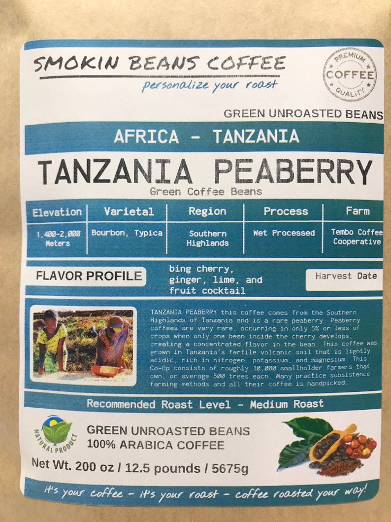 May include: A bag of green unroasted Tanzanian Peaberry coffee beans. The bag is labeled with the name "Smokin Beans Coffee" and the text "Green Unroasted Beans". The bag also includes information about the coffee's origin, flavor profile, and recommended roast level. The bag is 200 ounces or 12.5 pounds.