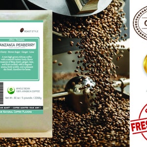 May include: A brown paper bag with a label that reads "Smokin Beans" and "Tanzania Peaberry" coffee. The label also lists the coffee's flavor notes: cherry, brown sugar, ginger, and lime. The bag is filled with whole bean coffee and has a net weight of 30 ounces or 5 pounds.