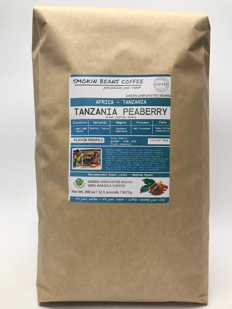 May include: A brown paper bag with a label for Tanzania Peaberry green unroasted coffee beans. The label includes information about the coffee's origin, variety, region, process, farm, flavor profile, and recommended roast level. The bag weighs 12.5 pounds or 200 ounces.