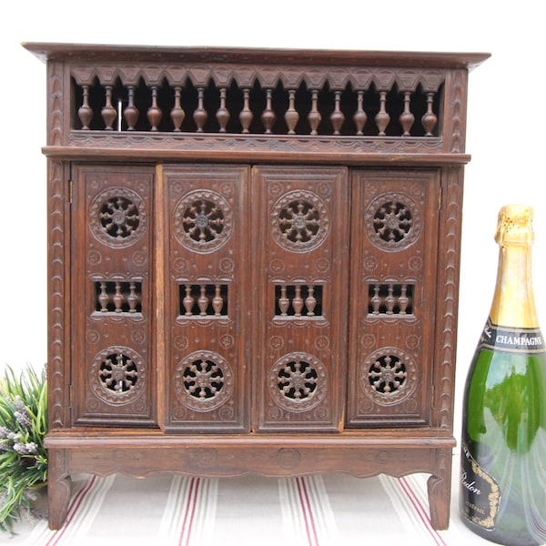 French larger famous carved Bretton miniature Wardrobe Armoire carved in the traditional way of Bretton furniture