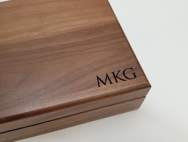 Walnut keepsake box, a large wooden box measuring 8x10 outside, 7x9 inside.  Shown with three letter monogram on the lower right corner of the lid.   Box is a beautiful brown in color with clear finish, and has a black velvet lining.