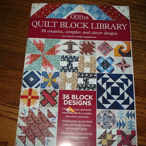 May include: A book titled "Quilt Block Library" with a red and white cover. The cover features a grid of 36 colorful quilt block designs. The book promises creative and clever designs, with instructions and tips included.