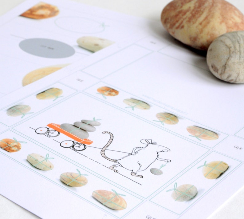 May include: A black and white illustration of a mouse pulling a red wagon with a stack of gray stones. The wagon has two wheels and a handle. The mouse has a long tail and is wearing a bow tie. The illustration is surrounded by a border of small gray stones.