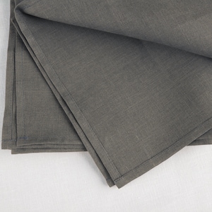 Folded graphite linen napkins, close view