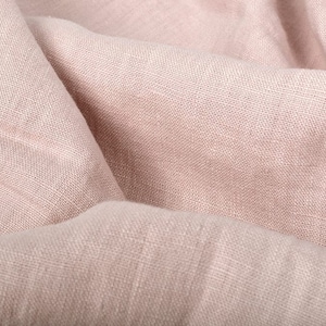 Close-up of draped dusty pink linen fabric
