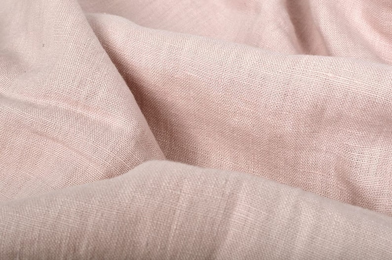 Close-up of draped dusty pink linen fabric