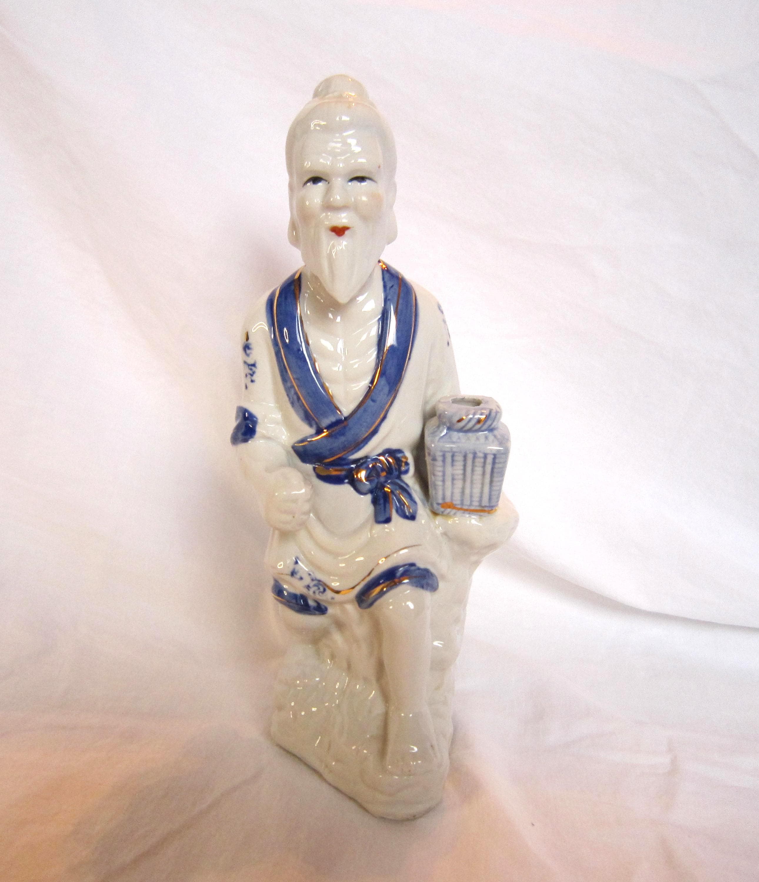Vintage 1980 Porcelain Asian Fisherman Figurine in Cream and Tan - Unbranded display picture 1