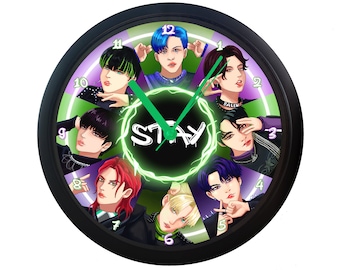 May include: A black clock with a green and purple background featuring a group of eight cartoon figures. The clock face has the word "STAY" in neon green letters and the numbers 1 through 12 around the edge.