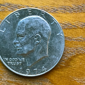 1974 Eisenhower Dollar no mint mark VF Condition