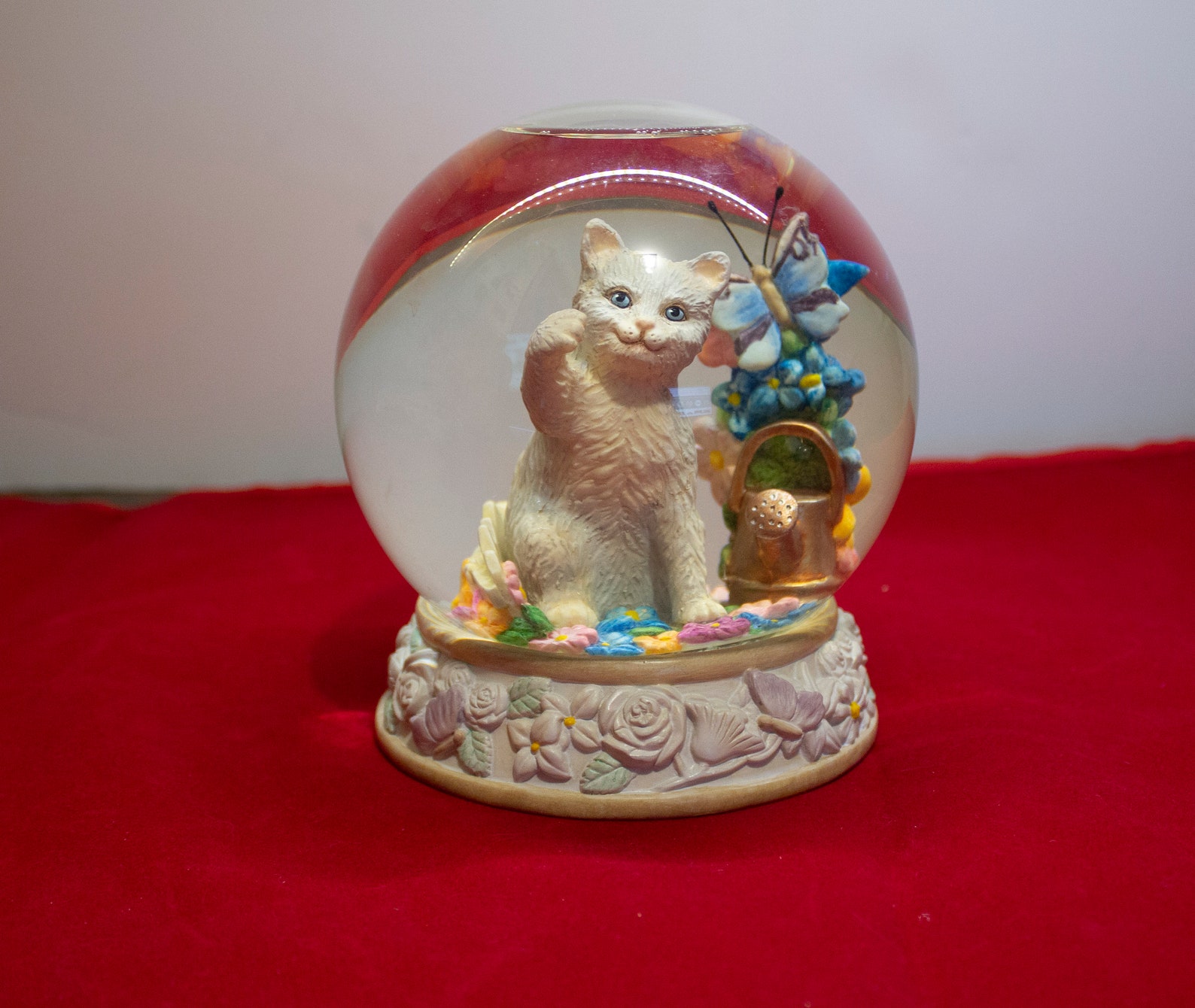 Lenox cat snow globe entitled Curiosity in Bloom. Etsy