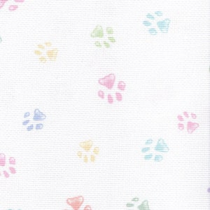 May include: White fabric with a repeating pattern of pastel coloured paw prints. The paw prints are in shades of pink, blue, green, and yellow.