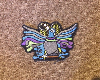 The Liquid Pigeons iron on patch