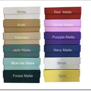 May include: A stack of 12 small gift boxes in various colors and finishes, including white, red matte, kraft, orchid matte, oatmeal, purple matte, jade matte, navy matte, blue ice gloss, silver, forest matte, and gold.