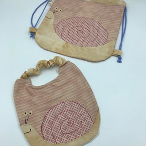 Coordinated backpack and snail bib set
