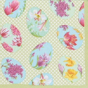 May include: A green background with a pattern of white crosses.  There are 10 pastel blue eggs with floral designs.  The flowers include lilies, tulips, irises, and lilacs.