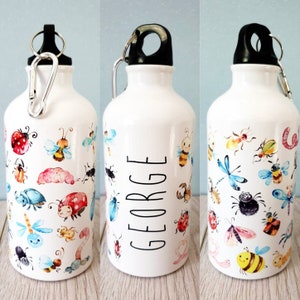 May include: White water bottle with a black cap, silver clip, and a colourful insect design. The bottle is decorated with watercolour illustrations of bugs, including ladybirds, bees, and dragonflies. The name "GEORGE" is printed on the bottle.