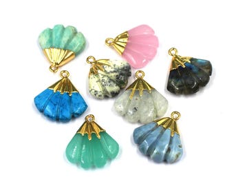 May include: Eight gold-plated shell-shaped pendants with different colored gemstones. The gemstones include turquoise, green, pink, blue, white, and gray.