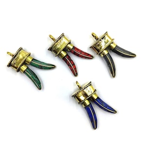 May include: Four gold-toned pendants, each with two horns. The horns are made from different coloured stones: green, red, black, and blue.